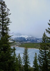 Fog over the Rocky Mountain and lake