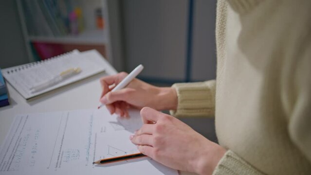 Teacher hands putting marks apartment closeup. Unknown woman correcting homework