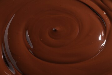Tasty melted chocolate as background, closeup view