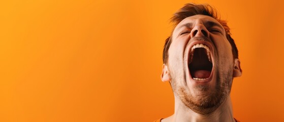 Man Screaming With Mouth Open Wide Against Orange Background