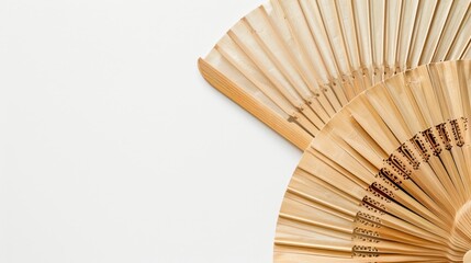Top view of bamboo fan on white background with copy space