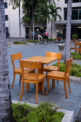 Wooden brown table chairs in the public park