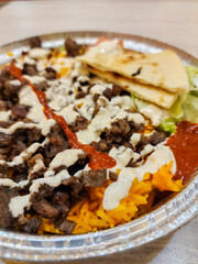 Delicious basmati rice with beef grilled, salad, chili sauce, and mayonnaise 