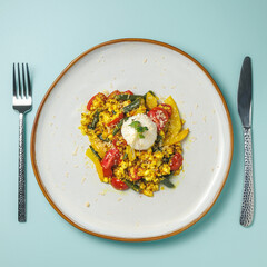 An easy and healthy vegan breakfast. Tofu cheese scramble with beans and tomatoes. view from above. Cafe and restaurant menu. Healthy eating. No eggs. gluten free