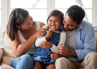 Family, laugh and child in home living room for support, unity and tickle with parents in lounge....