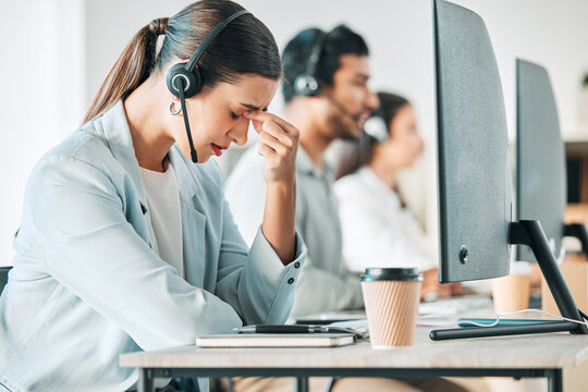 Call center, computer and depression with woman in telemarketing office for assistance or help. Desk, headset and stress with employee at work for customer service or support as virtual assistant
