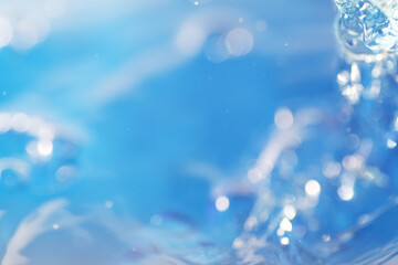 Macro shot of water splashing on blue background