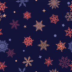 Christmas seamless pattern of beautiful complex colored snowflakes on dark blue background. Winter illustration with falling snow.