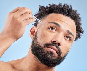 Man, studio and serum on face for skincare, cosmetic application and facial treatment for hydration...