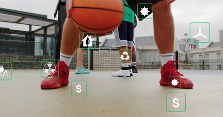 Fototapeta premium Image of multiple icons over diverse people practicing basketball in outdoor court