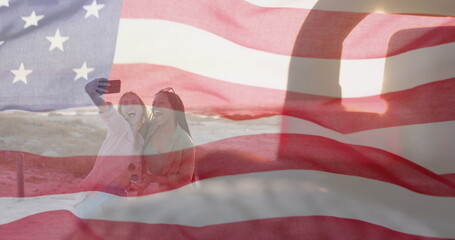 Image of flag of usa over happy diverse women by car by beach in summer