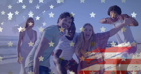 Image of flag of usa over happy diverse friends on beach in summer