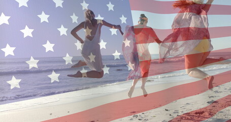 Image of flag of usa over happy diverse friends on beach in summer