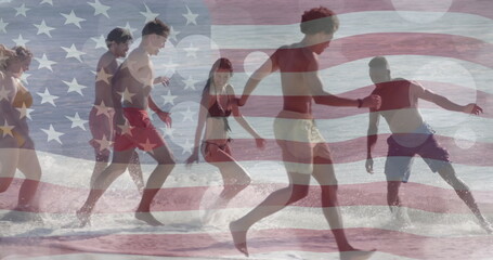 Image of flag of usa over happy diverse friends on beach in summer