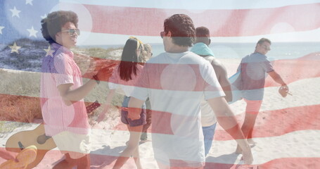 Image of flag of usa over happy diverse friends on beach in summer