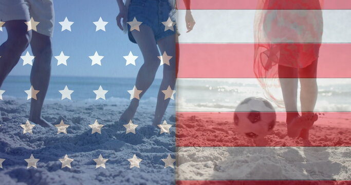 Image of flag of usa over diverse friends playing football on beach