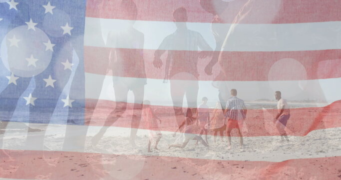 Image of flag of usa over happy diverse friends on beach in summer - Powered by Adobe