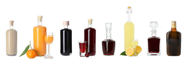 Collection of different tasty liqueurs on white background