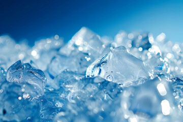 Close-up of ice cubes glistening against a blue background, capturing the refreshing and cooling essence of frozen water.