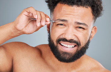 Obraz premium Man, portrait and tweezers by eyebrow in studio for grooming, hair removal and hygiene or skincare. Male person, cosmetic tool and product for facial epilation, gray background and wellness routine.