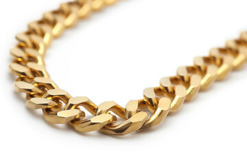Obraz premium Close-up of a gold chain necklace with a polished finish, lying in a smooth curve against a white background, ideal for fashion, jewelry, and luxury themes, showcasing elegance and style.