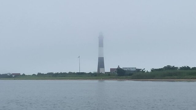 View of the Fire Island Lighthouse in the fog from the Great South Bay.