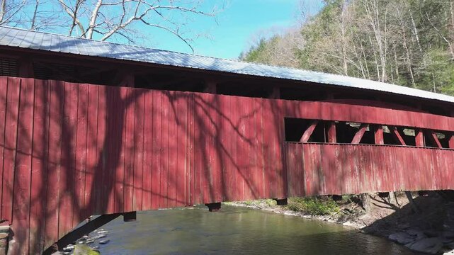 Josiah Hess covered bridge near Orangeville PA. Rotating pan shot along the side of the bridge. Shot on an early Spring day.