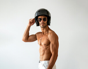 30s sexy man wearing a black motorcycle helmet and sunglasses, he is shirtless, muscular model isolated on white background. 