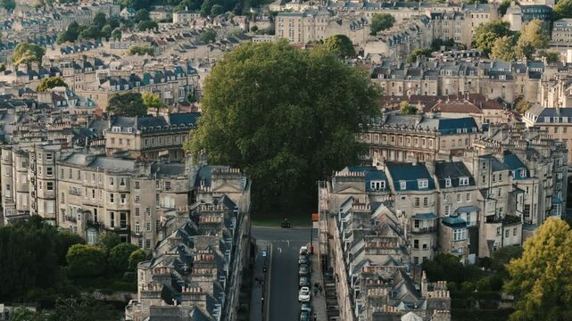 The Circus homes in Bath Somerset UK England, drone approaches ascending pan up