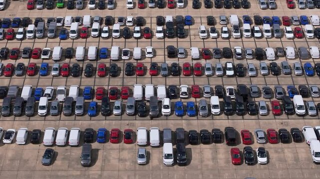 Rows of unwanted new and used vehicles aerial view stored on former RAF Thurleigh runway