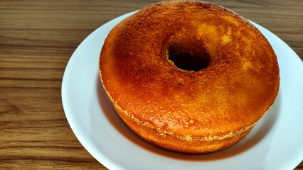 Traditional cornmeal brazilian cake on the wooden table with copy space. Food from Minas Gerais state and from brazil.