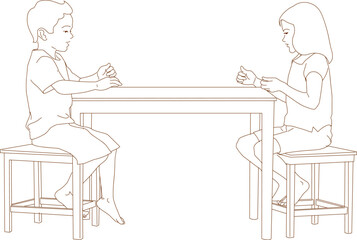 Boy and girl sitting at table