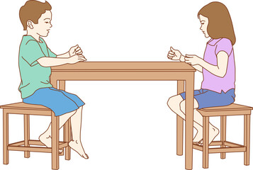 Boy and girl sitting at table