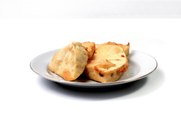 Fried breadfruit is a food made from thinly sliced ​​breadfruit coated in a wheat flour mixture then fried until dry and crispy. Fried breadfruit isolated on white background.