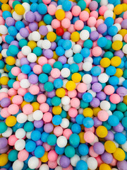 pile of colorful plastic balls on the children's playground, top view