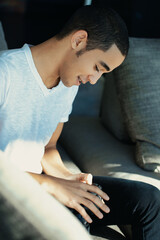 Man in white t-shirt reviewing camera photos