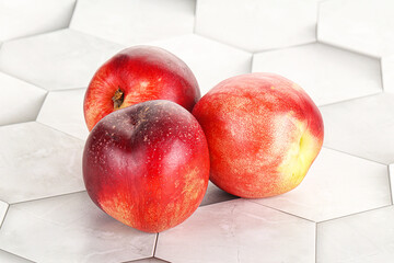 Ripe sweet juicy nectarines heap