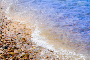 Top view of background for summer vacation concept. Nature of the beach and sea, summer with sunlight, sandy beach The sparkling sea water