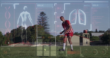 Image of screen with biological data over biracial male soccer player during training