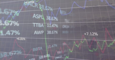 Image of light over financial data over foggy cityscape