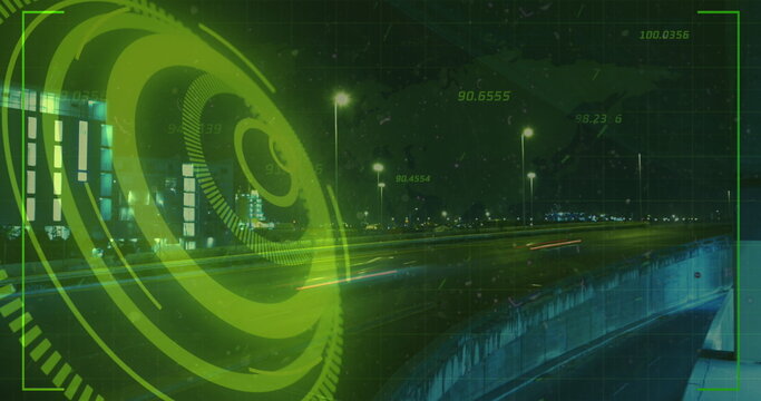 Image of neon round scanner and light trails against city traffic at night