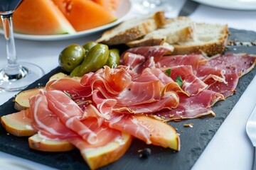 Delicious Appetizer of Prosciutto, Melon, and Olives