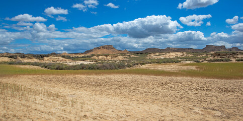 Fototapeta premium scenic view on Bardenas Reales desert in Spain under sky with nwhite clouds