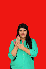 Young adult woman in her 30s uses the Mexican Sign Language used by deaf people in Mexico