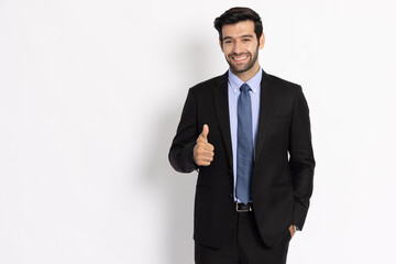 Young businessman in suit showing thumbs up isolated on white background