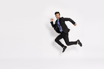 Happy Young businessman jumping in air isolated on white background, Full length composition