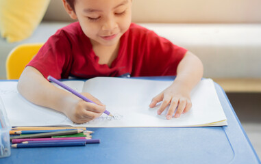 Creativity concept. Adorable nice child in domestic clothes having fun, enjoying holiday