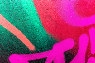 bright colorful pattern of beautiful street wall with art graffiti background. Vivid modern urban texture for wallpaper and design