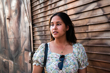 Fototapeta premium Portrait of a Generation Z female on the Sstreet