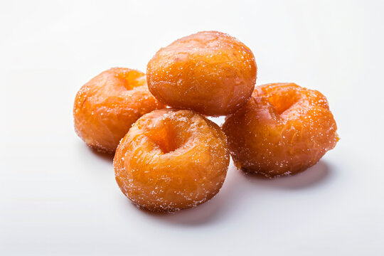 a group of donuts sitting on top of a white surface
